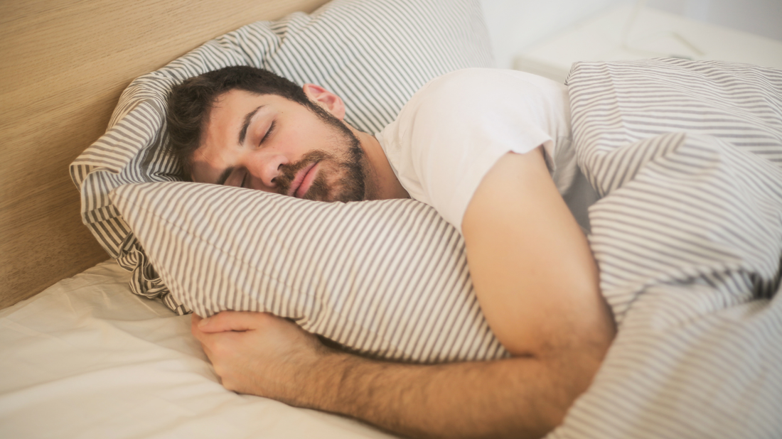 A person resting peacefully — how meditation and Yoga Nidra support deep, restorative sleep