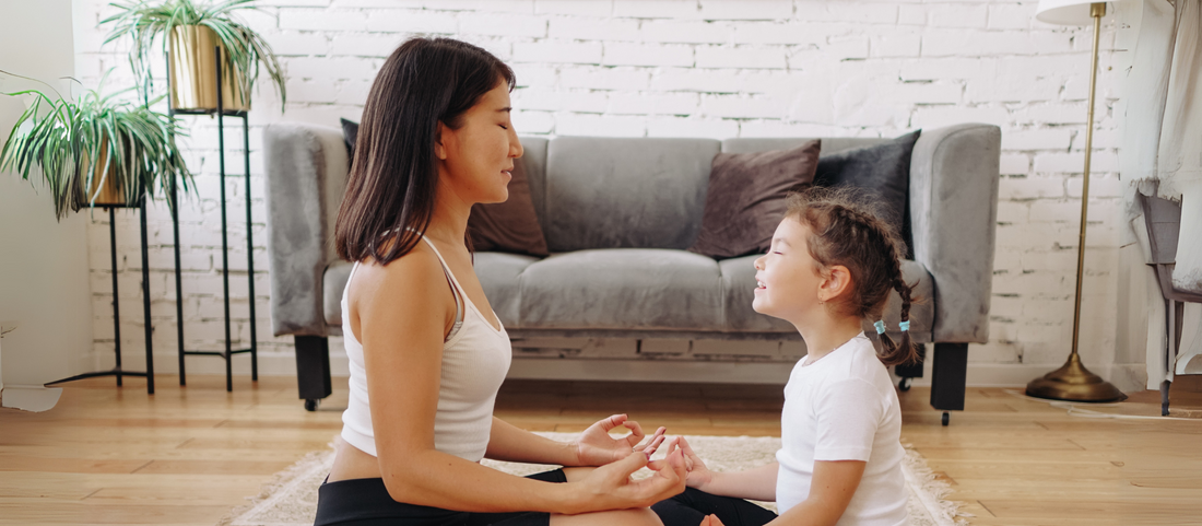 Young child and mother in relaxation practising Yoga Nidra — supporting sleep, calm and emotional wellbeing in early childhood